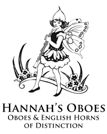 Picture of Hannah's Oboe logo, which says "Oboe Fairy" with a picture of a fairy with wings holding an oboe. Below it says "Hannah's Oboes, Oboes & English Horns of Distinction."